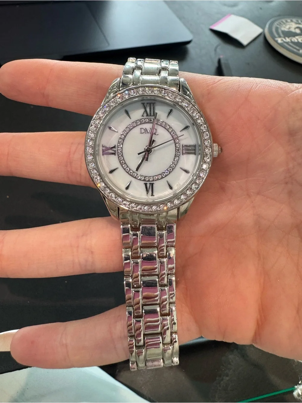 New DMQ Women's Quartz Watch – Silver Tone, Crystal Accent Bezel & Roman Numeral